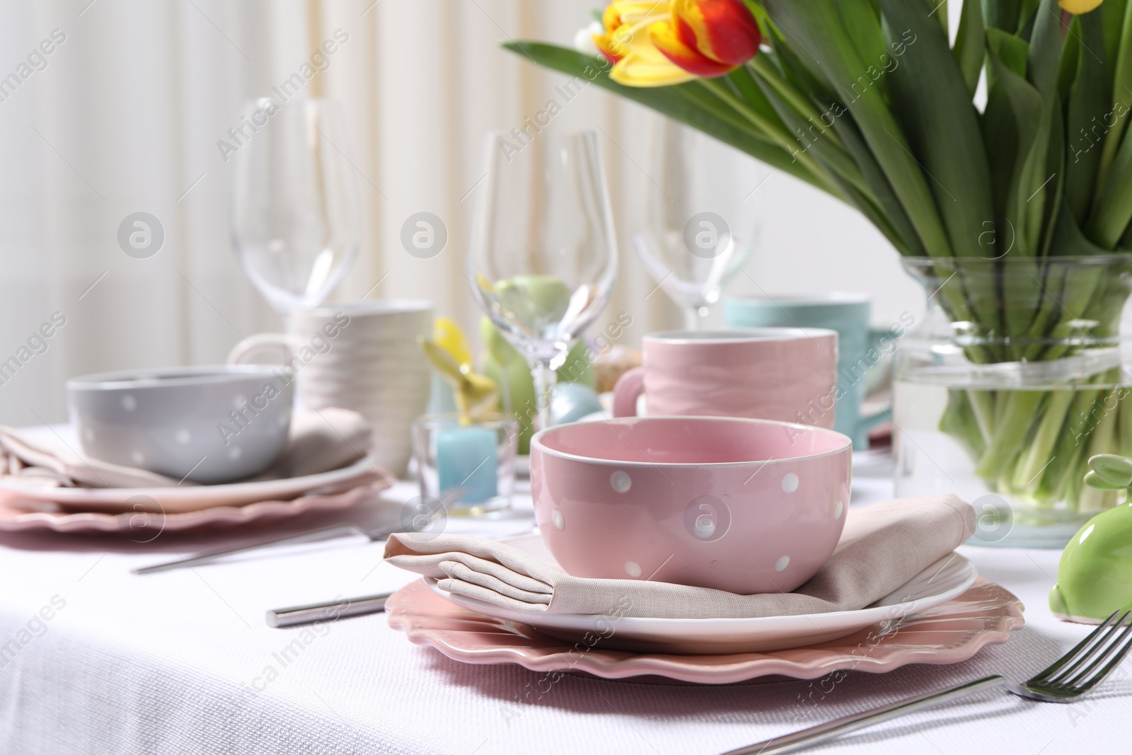 Photo of Festive table setting with beautiful flowers. Easter celebration