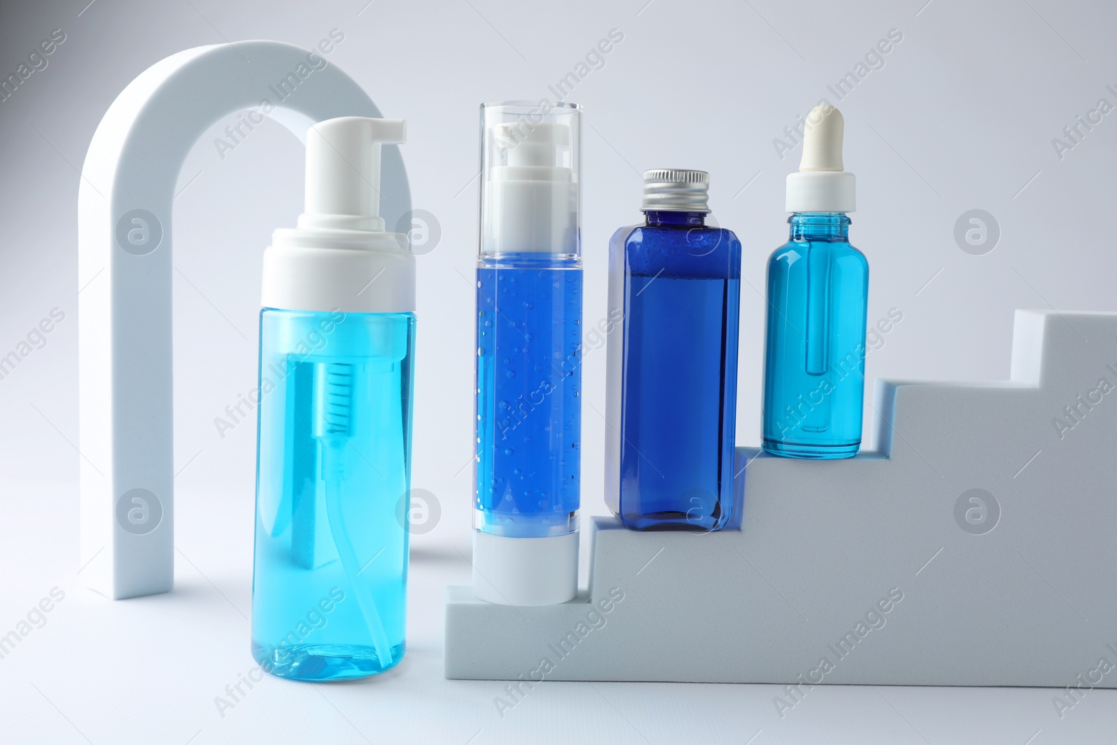 Photo of Stylish presentation of luxury cosmetic products on white background