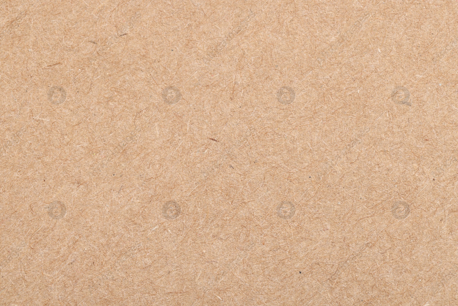 Photo of Texture of beige paper sheet as background, top view