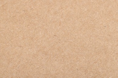 Photo of Texture of beige paper sheet as background, top view