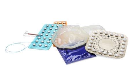Contraceptive pills, condoms and intrauterine device isolated on white. Different birth control methods