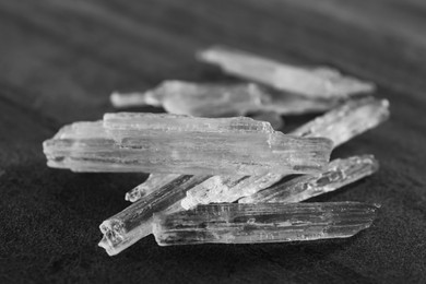 Photo of Menthol crystals on grey background, closeup view
