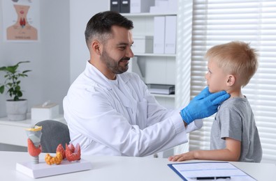 Photo of Little boy having appointment with endocrinologist at hospital