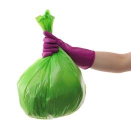 Photo of Woman holding plastic bag full of garbage on white background, closeup