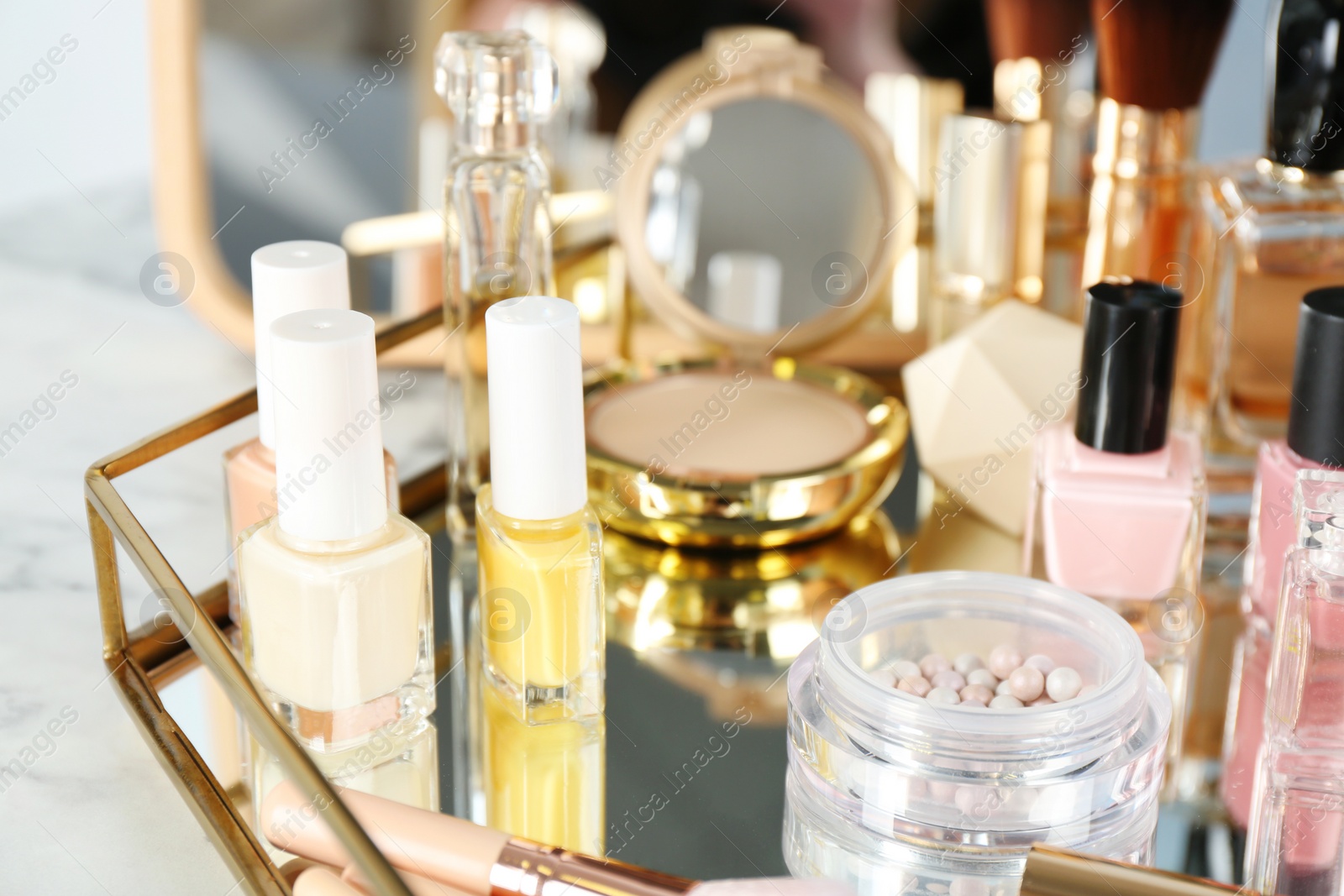 Photo of Tray with set of luxury cosmetics on dressing table