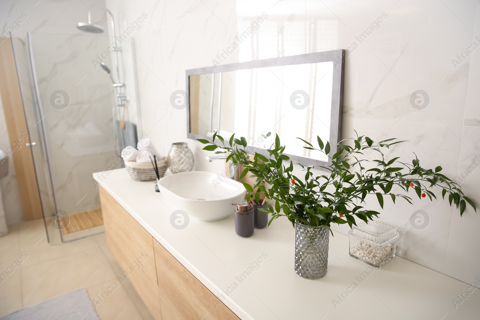 Photo of Modern bathroom interior with stylish mirror and vessel sink