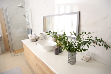 Photo of Modern bathroom interior with stylish mirror and vessel sink