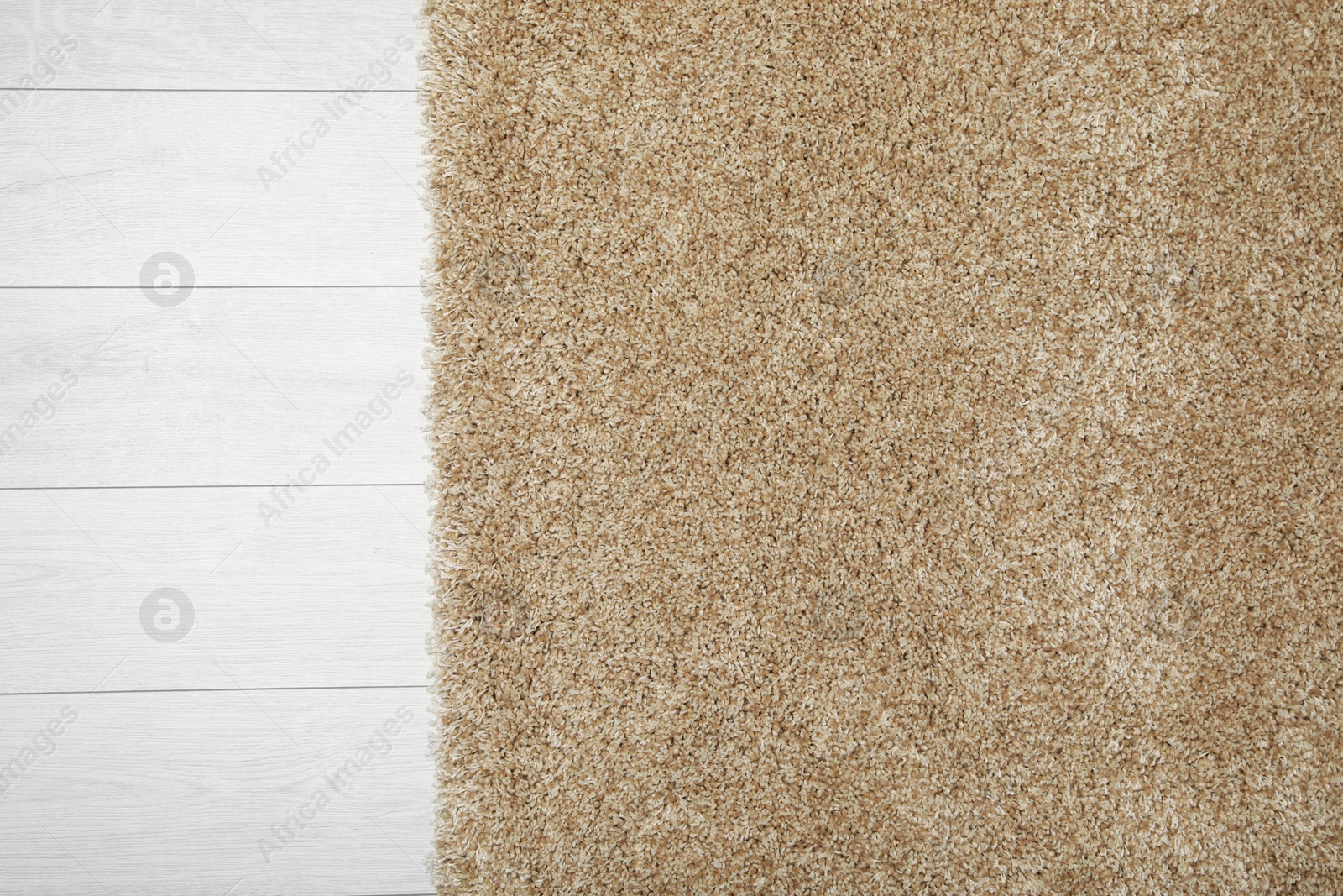 Photo of Beautiful beige carpet on floor, top view. Space for text