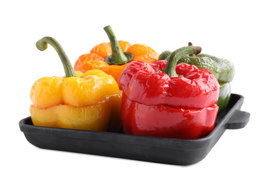 Photo of Tasty stuffed bell peppers in baking pan isolated on white