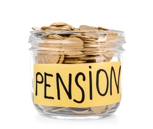 Photo of Glass jar with label "PENSION" and coins on white background