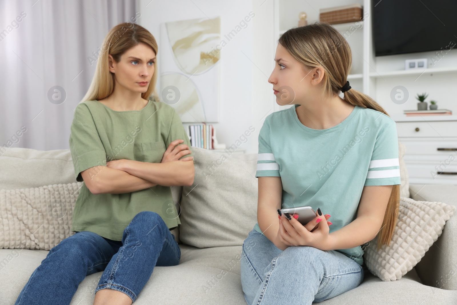 Photo of Mother angry at her daughter in living room