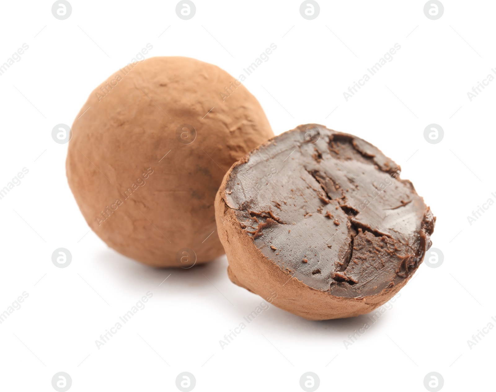 Photo of Delicious raw chocolate truffles on white background