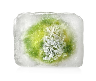 Photo of Brussels sprouts in ice cube on white background. Frozen vegetables