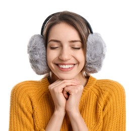 Happy woman wearing warm earmuffs on white background