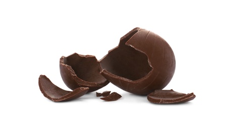 Photo of Broken milk chocolate egg on white background