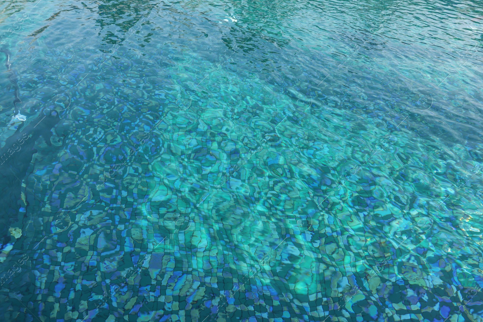 Photo of Clear rippled water in swimming pool outdoors