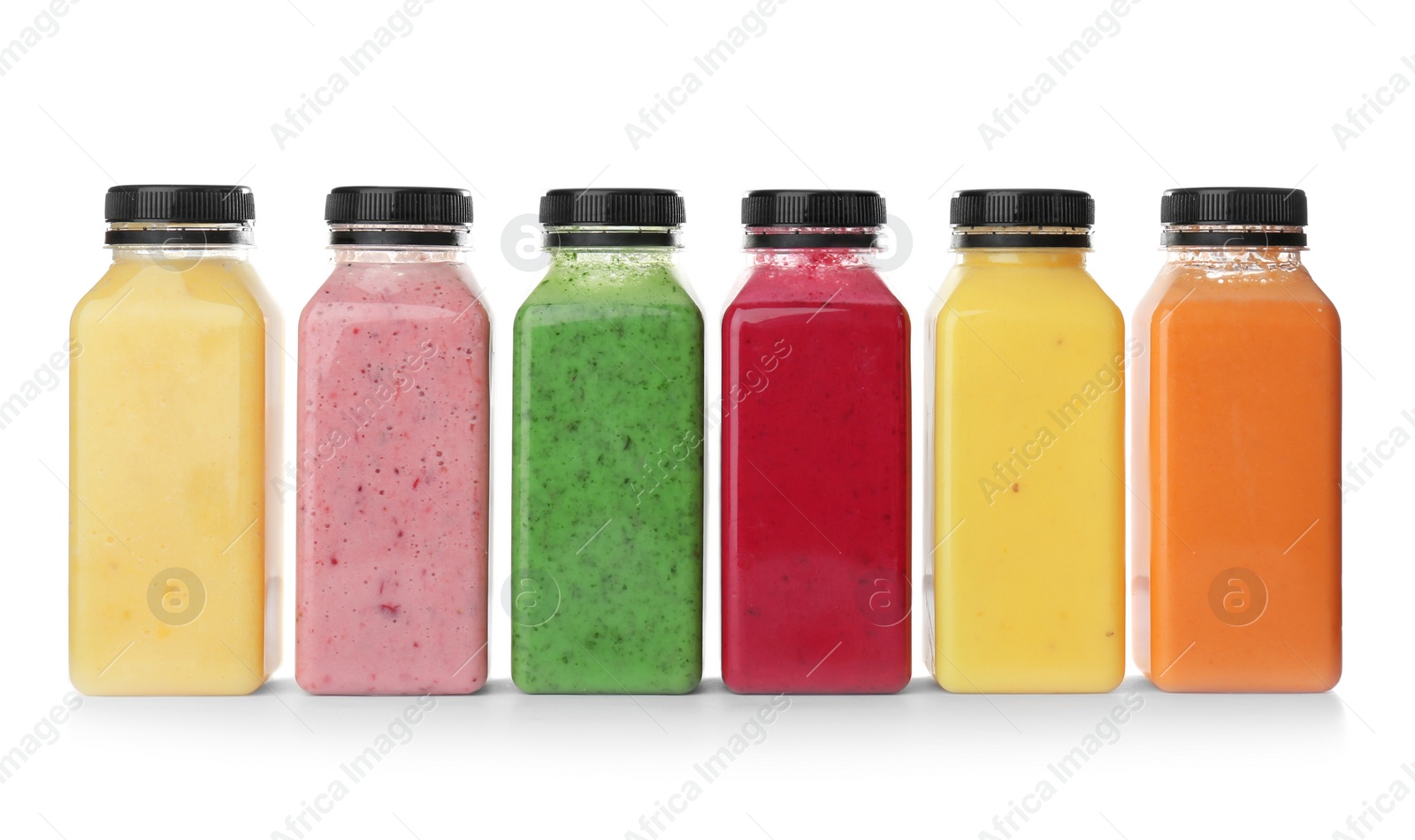 Photo of Bottles with delicious detox smoothies on white background