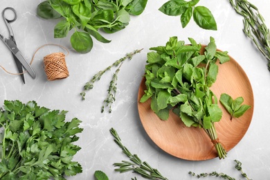 Photo of Flat lay composition with fresh green herbs on grey background