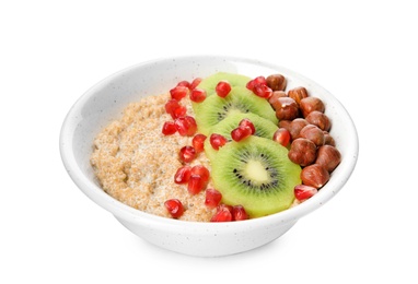 Photo of Bowl of quinoa porridge with hazelnuts, kiwi and pomegranate seeds on white background