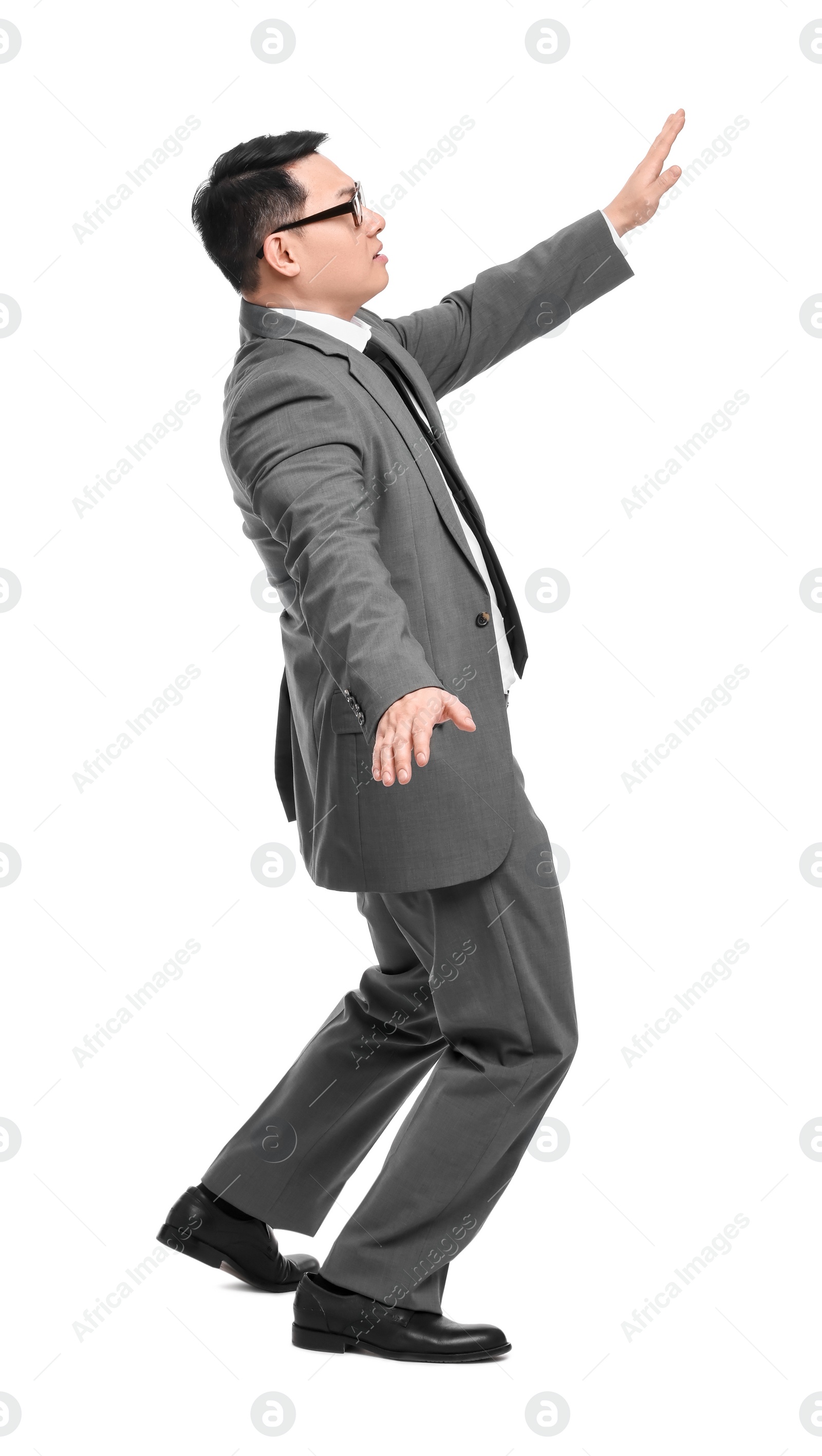 Photo of Businessman in suit posing on white background