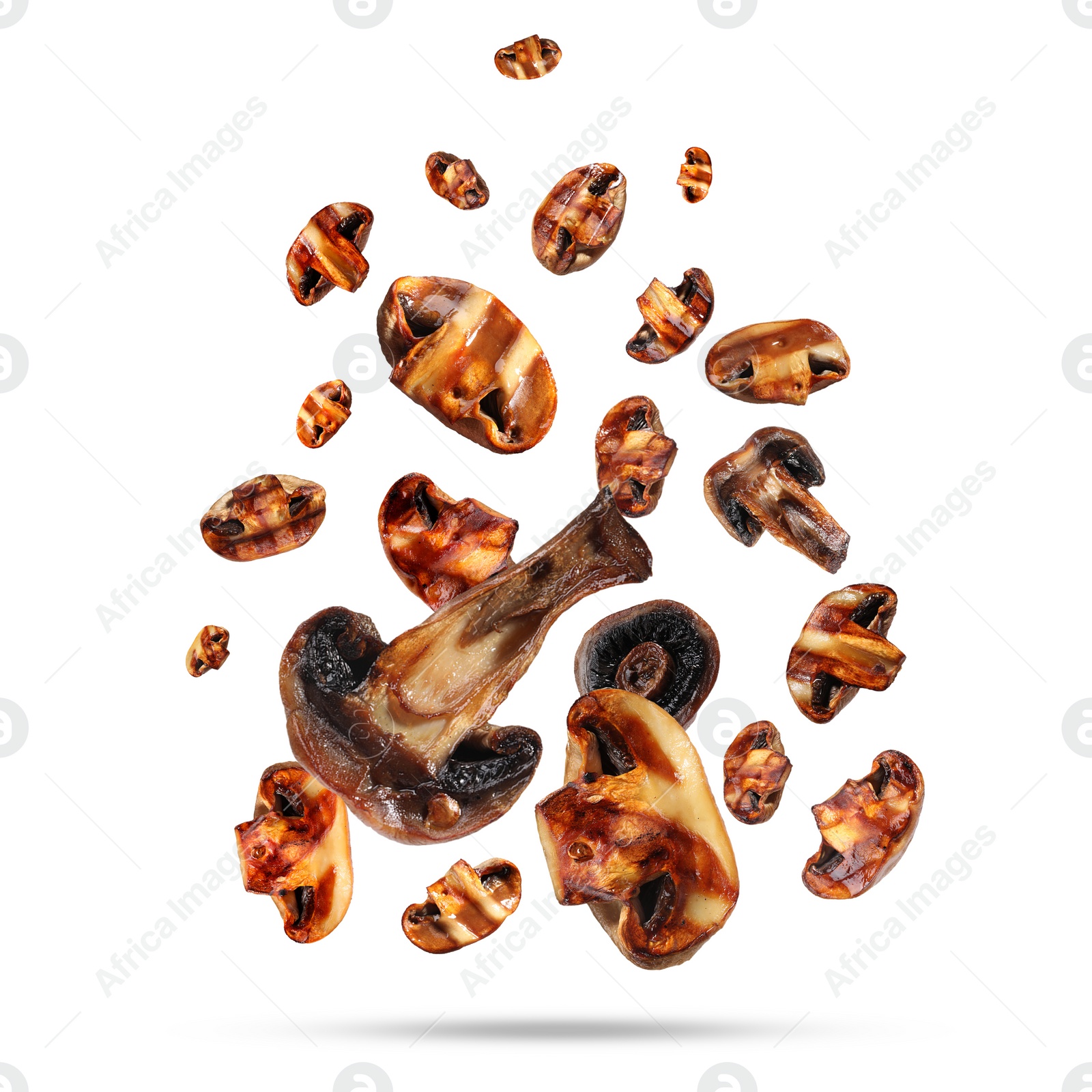 Image of Slices of grilled mushrooms in air on white background