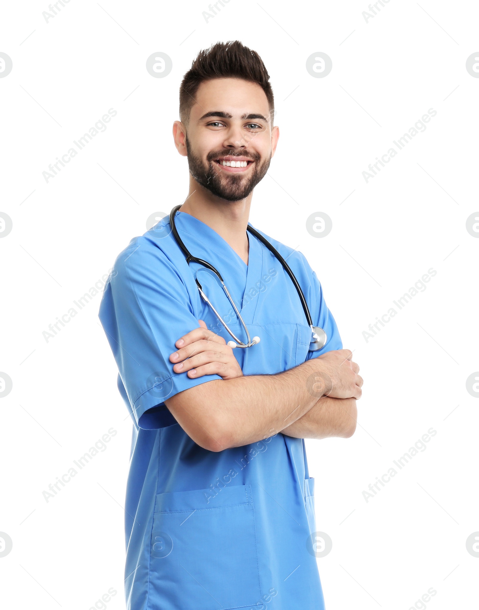 Photo of Young male doctor in uniform isolated on white