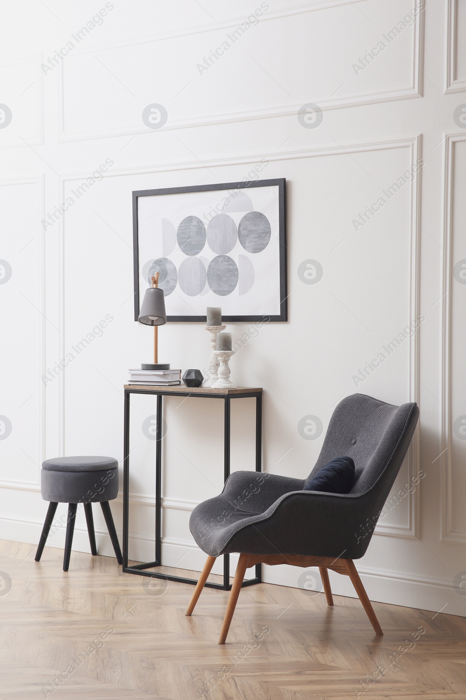 Photo of Hallway with stylish console table and armchair. Interior design