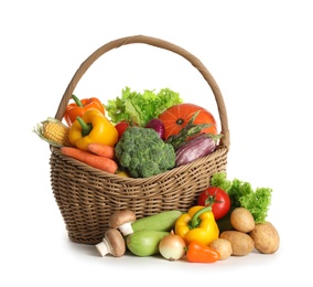 Wicker basket with fresh vegetables on white background
