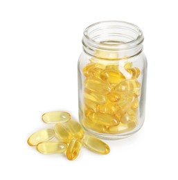 Bottle and pile of softgel capsules isolated on white