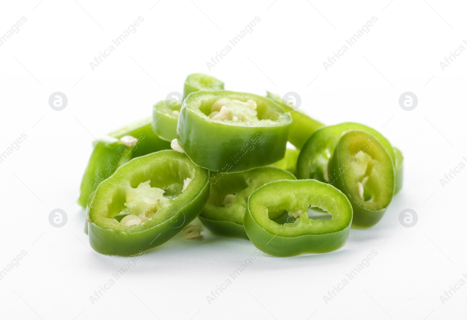 Photo of Pile of cut chili peppers on white background