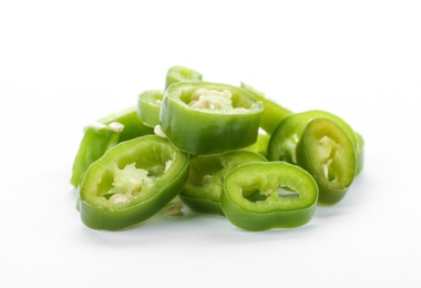 Photo of Pile of cut chili peppers on white background