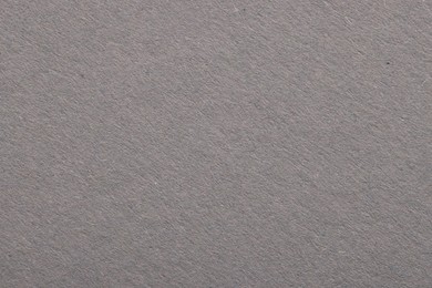 Texture of light grey paper sheet as background, top view