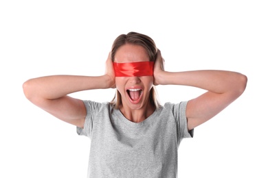 Young woman wearing red blindfold on white background