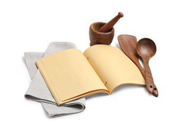 Photo of Blank recipe book, napkin and wooden utensils on white background. Space for text