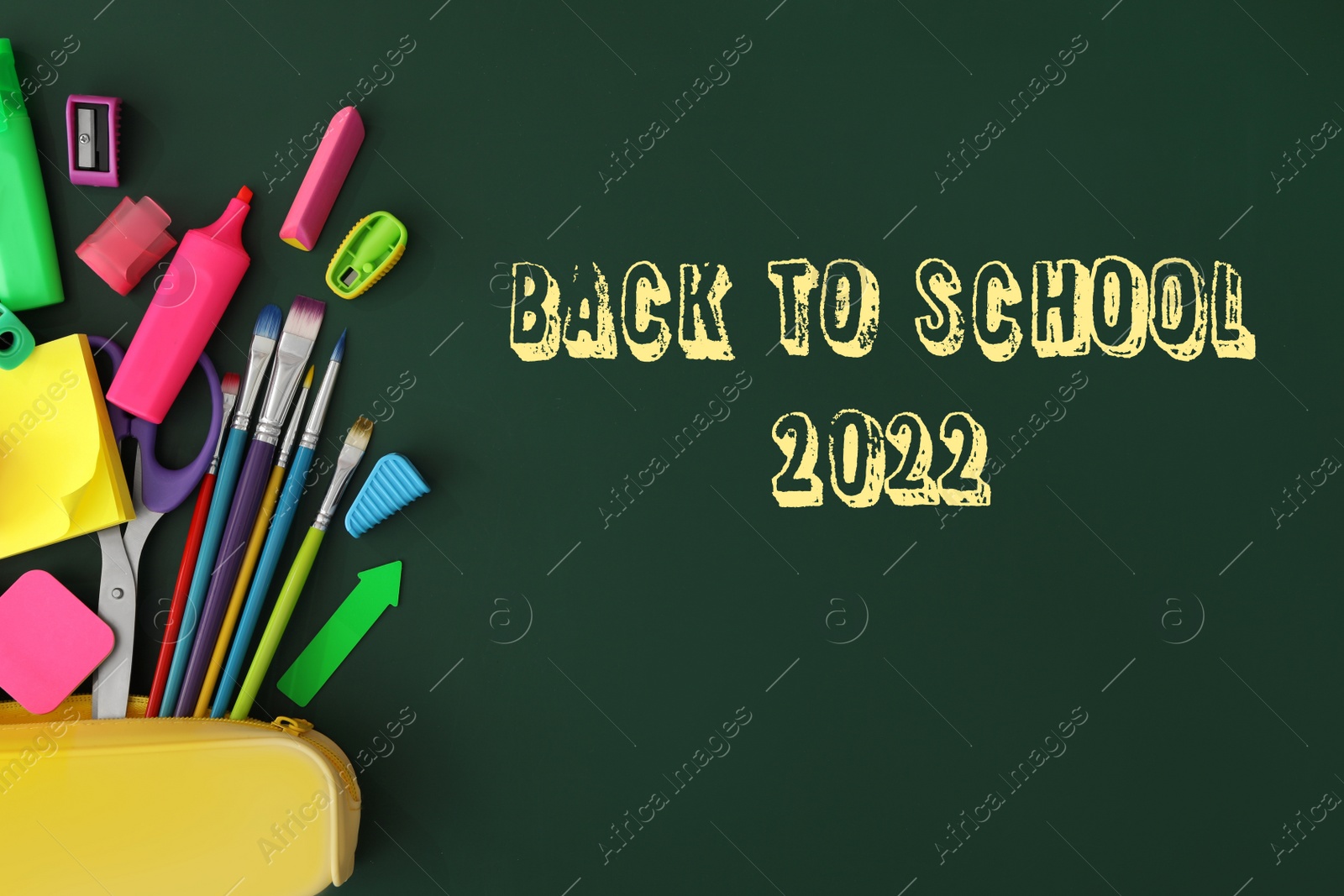 Image of Back to school 2022. Flat lay composition with different stationery on green chalkboard