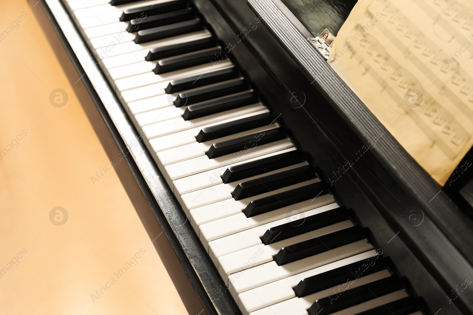 Photo of Modern piano with black and white keys, above view