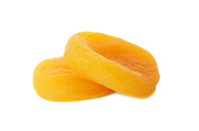 Photo of Two tasty apricots on white background. Dried fruits