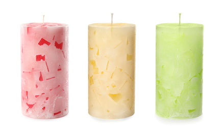 Image of Set of color wax candles on white background