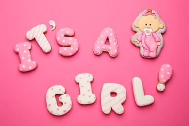 Photo of Phrase IT IS A GIRL made of tasty cookies on pink background, flat lay. Baby shower party