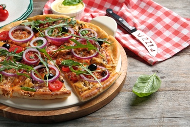 Tasty fresh homemade pizza on wooden table