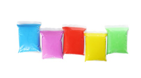 Photo of Packages of colorful play dough on white background, top view