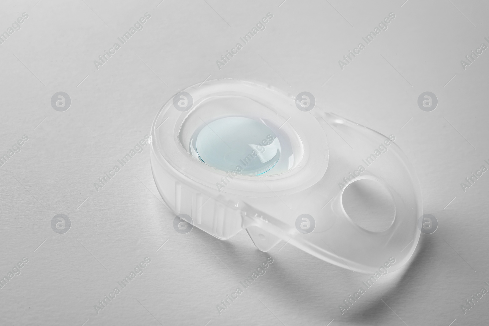 Photo of Package with contact lens on white background