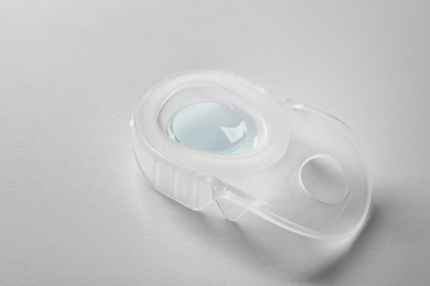 Package with contact lens on white background
