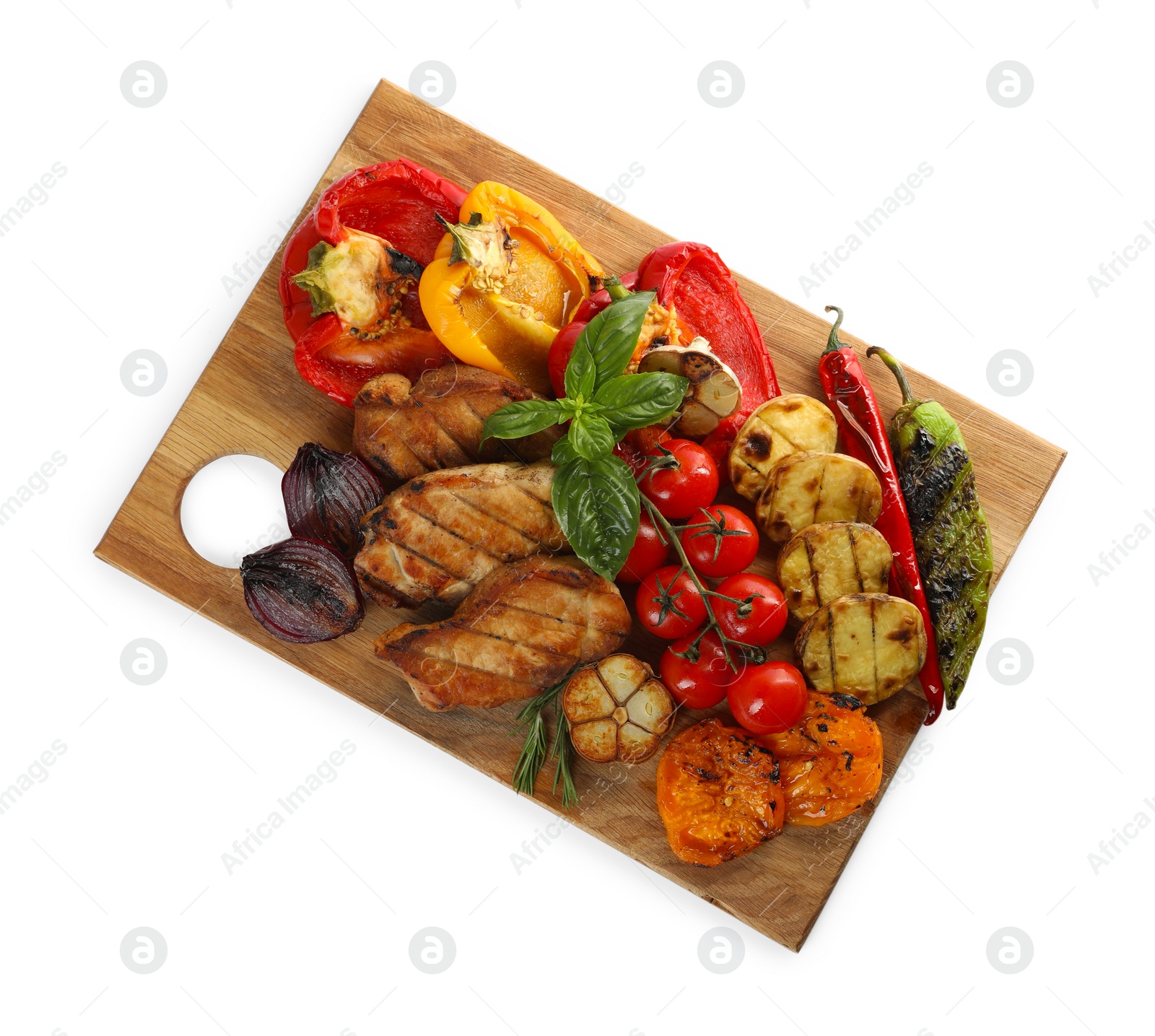 Photo of Wooden board with tasty grilled vegetables, meat, rosemary and basil isolated on white, top view