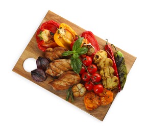 Photo of Wooden board with tasty grilled vegetables, meat, rosemary and basil isolated on white, top view