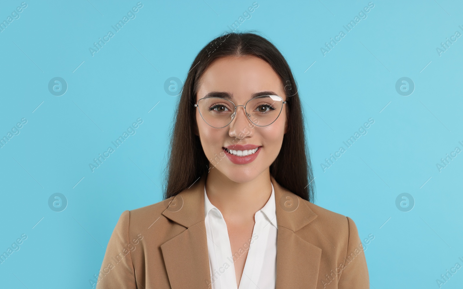 Photo of Beautiful woman wearing glasses on turquoise background