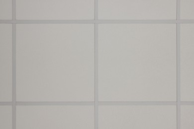 Photo of White ceiling with PVC tiles, view from below