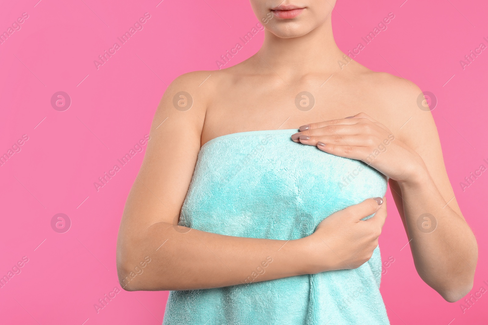 Photo of Woman checking her breast on color background, closeup