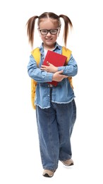 Cute little girl in glasses with book and backpack on white background