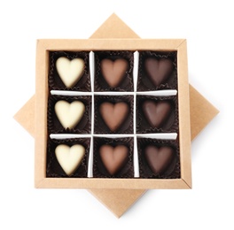 Tasty heart shaped chocolate candies in box isolated on white, top view. Valentine's day celebration
